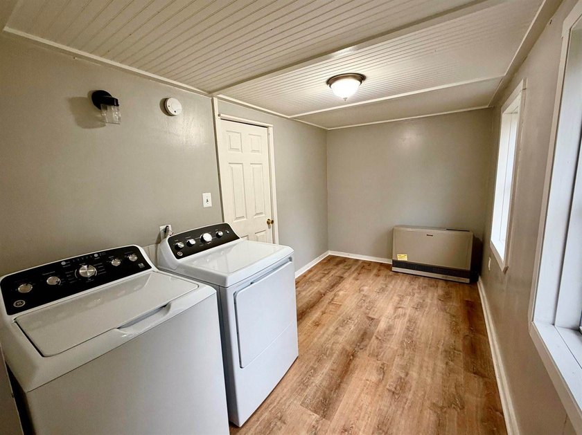 Step into this cozy 2-bedroom, 1.5-bath New Englander, where - photo 12