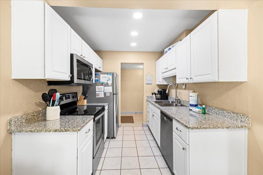 Welcome to this beautifully updated ground-floor condo in the - photo 7