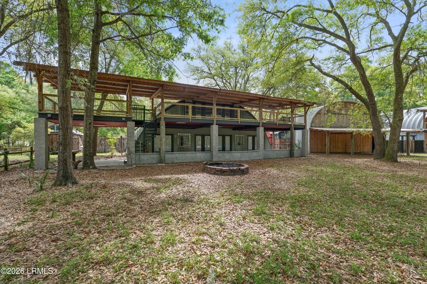 Tucked away down a quiet dirt road on 4.83 private acres on - photo 2