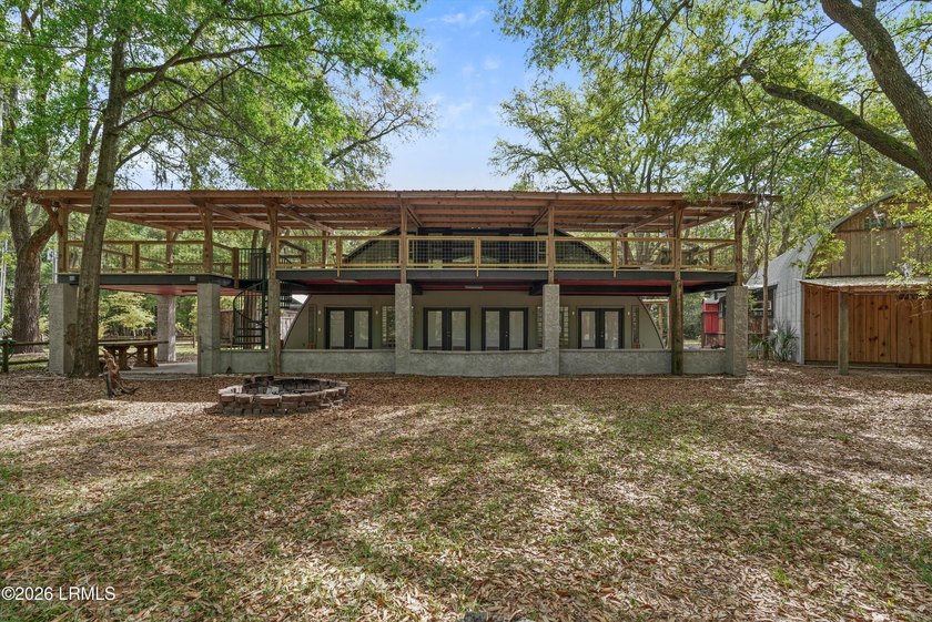 Tucked away down a quiet dirt road on 4.83 private acres on - photo 3