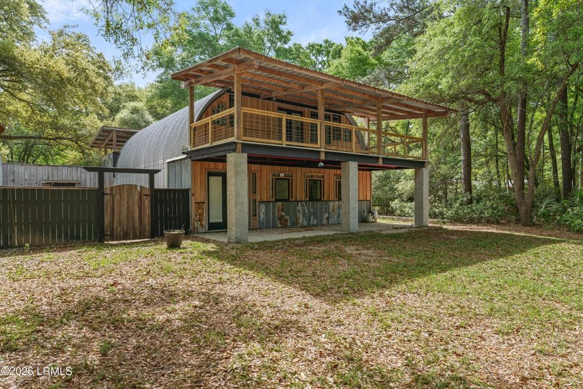 Tucked away down a quiet dirt road on 4.83 private acres on - photo 5