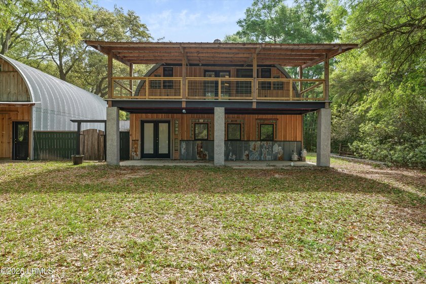 Tucked away down a quiet dirt road on 4.83 private acres on - photo 6