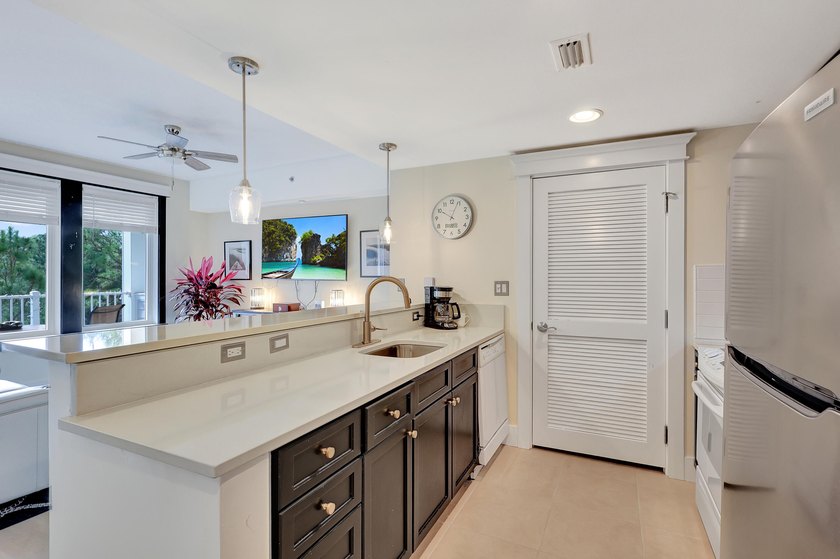From this third floor covered balcony, enjoy beautiful views of - photo 6