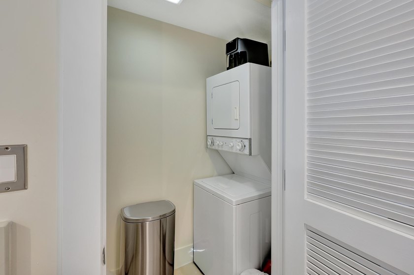 From this third floor covered balcony, enjoy beautiful views of - photo 8