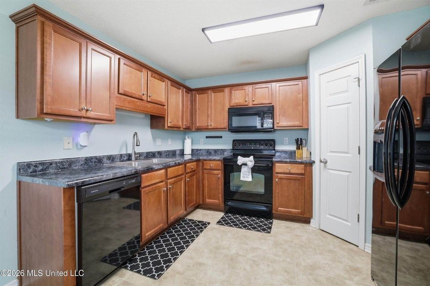 This beautiful brick home is located in a quiet subdivision with - photo 6