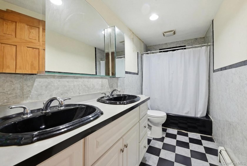 Beutifully Renovated 2 Family High Ranch, 6 Bedrooms, 4 Full - photo 11