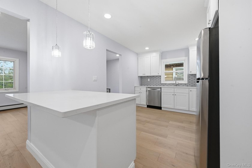 Beutifully Renovated 2 Family High Ranch, 6 Bedrooms, 4 Full - photo 15