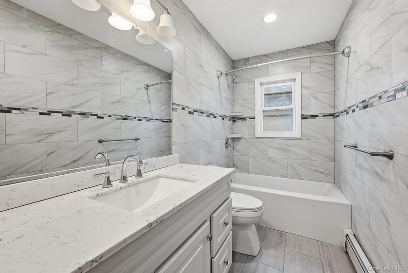 Beutifully Renovated 2 Family High Ranch, 6 Bedrooms, 4 Full - photo 17