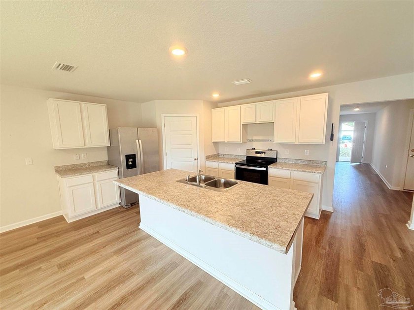 Welcome home to this like-new 4-bedroom, 2-bath residence - photo 2