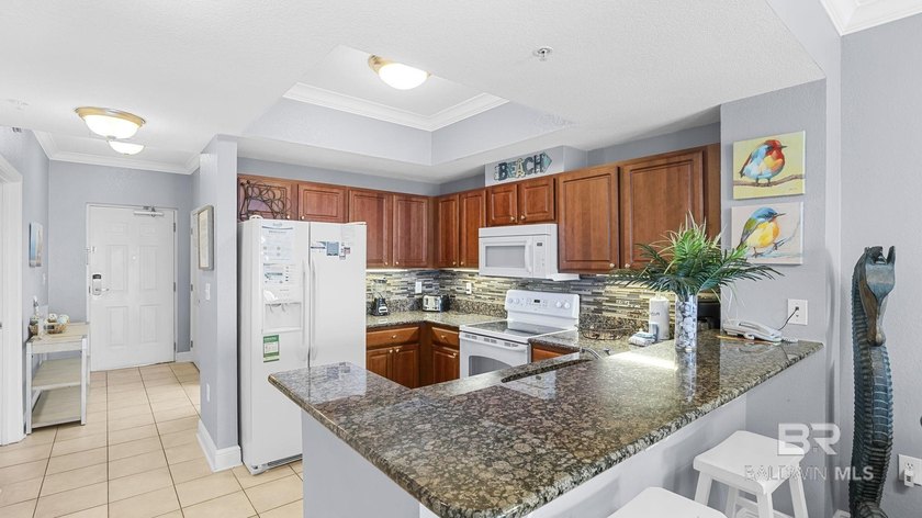 Set on the 18th floor, this 2-bedroom, 2-bath residence offers a - photo 3