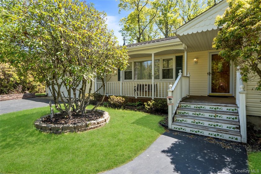 Nestled on a quiet cul-de-sac in one of East Setauket's most - photo 3