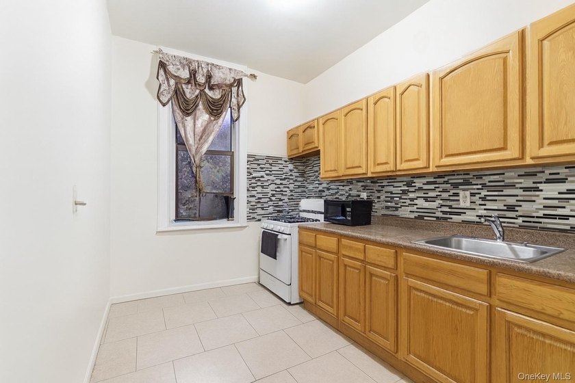 Exceptional brownstone six-unit multi-family building offering a - photo 11