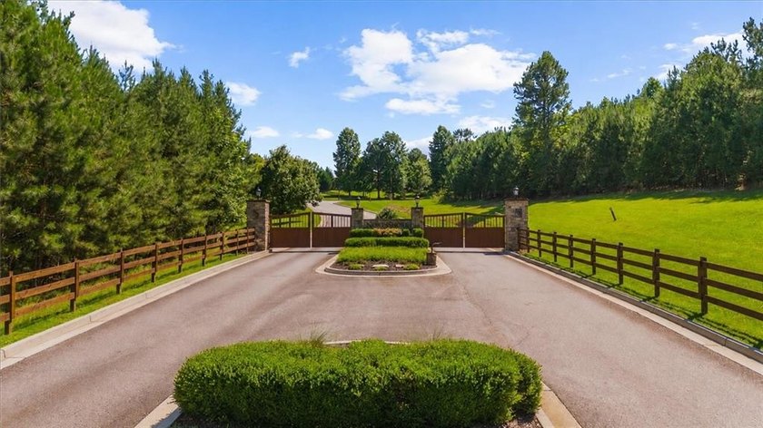 Exceptional 4.81-acre partially cleared lot in the gated - photo 4