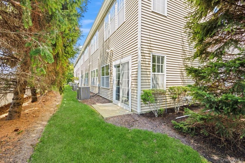 Welcome to this highly sought-after first-floor end unit located - photo 4