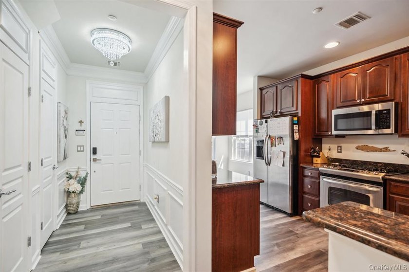 Welcome to this highly sought-after first-floor end unit located - photo 6