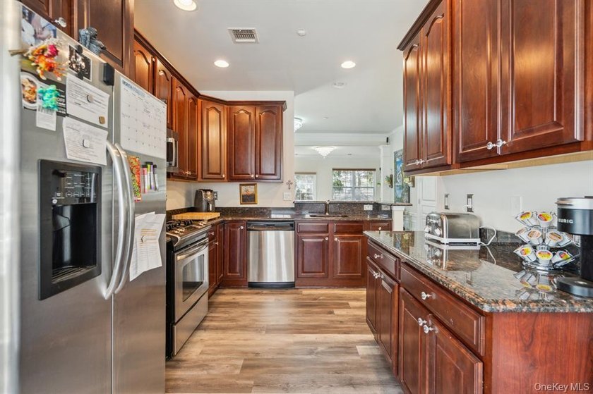 Welcome to this highly sought-after first-floor end unit located - photo 8