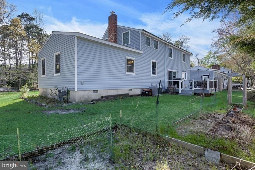 Welcome to this spacious 5-bedroom, 2.5-bath home nestled in the - photo 31