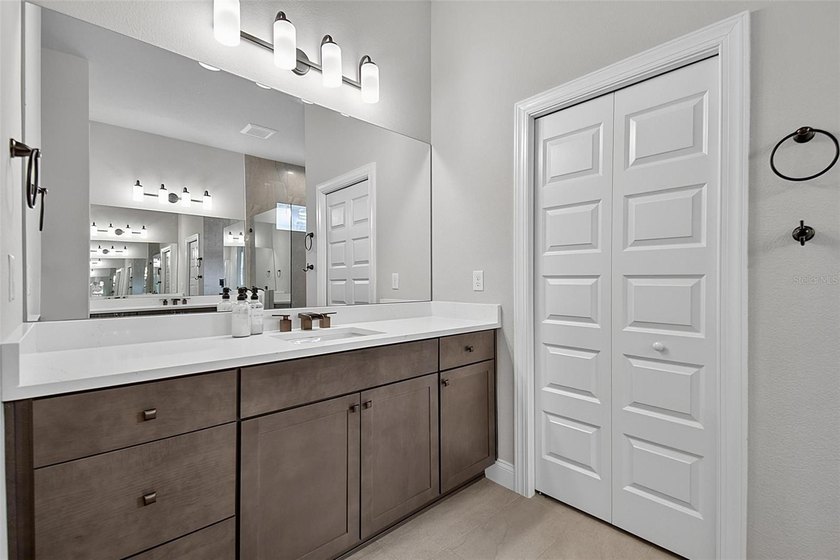 One-of-a-kind custom Gold Coast home, tucked within the private - photo 35
