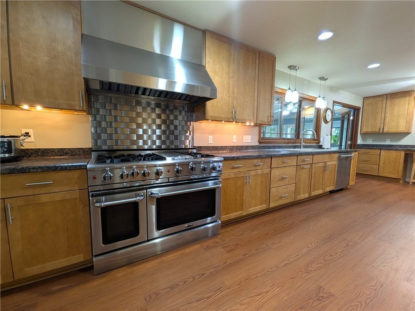 Welcome to this spacious and thoughtfully designed home that - photo 6
