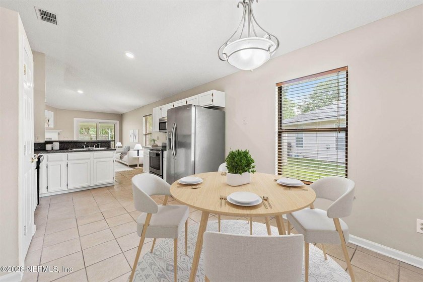 Welcome home to Bay Harbor! This spacious 4 bedroom, 2 bath - photo 7