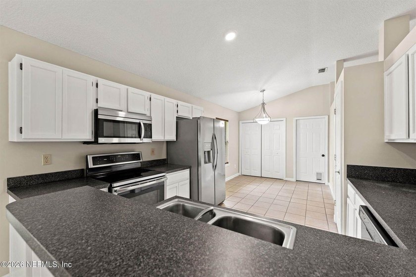 Welcome home to Bay Harbor! This spacious 4 bedroom, 2 bath - photo 8
