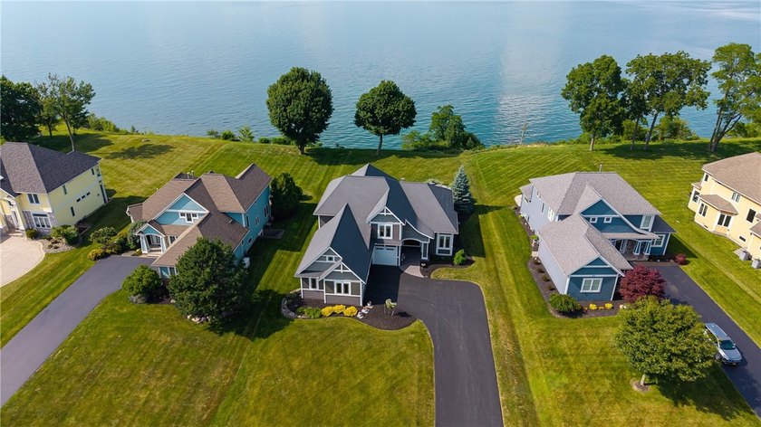 Welcome to waterfront living at its finest. Perched above the - photo 3