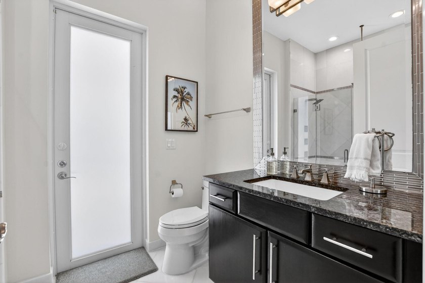 Situated on an oversized lot within the gated community of Azura - photo 13