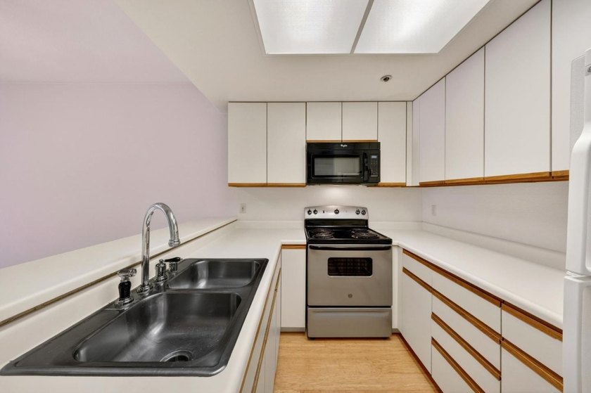 Welcome to 411 Park Ave, a desirable top-floor corner unit in a - photo 13