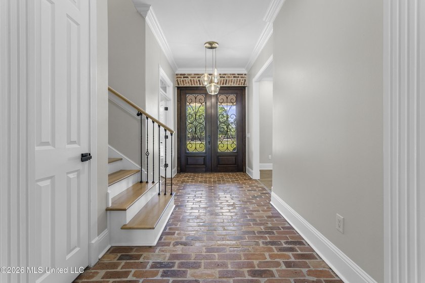 Tucked behind a gated entrance on 5 private acres, this - photo 11