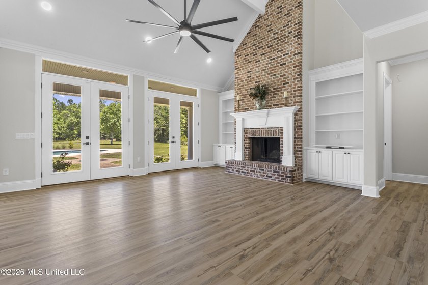 Tucked behind a gated entrance on 5 private acres, this - photo 12