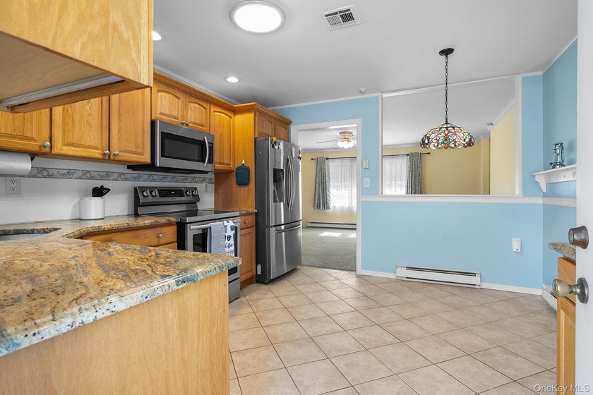 Welcome to the desirable Leisure Village, a vibrant 55+ gated - photo 3