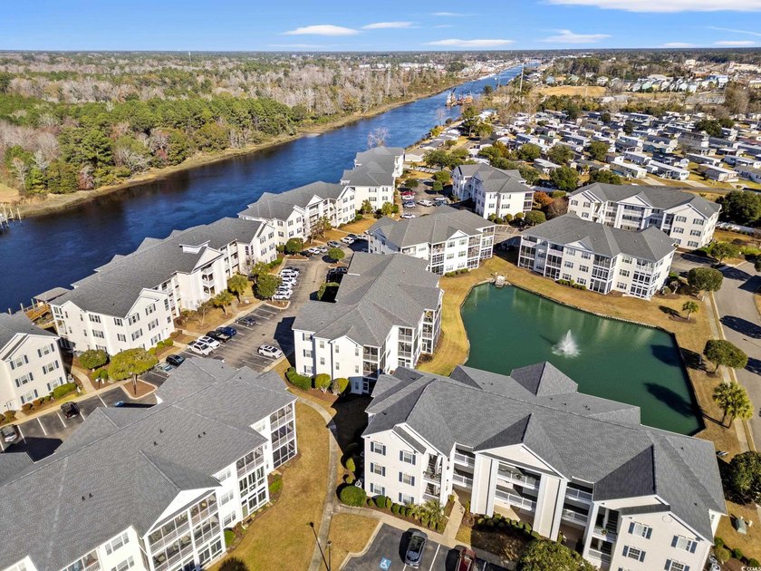 Refined Top-Floor Residence with Waterway and Pool Views in - photo 37