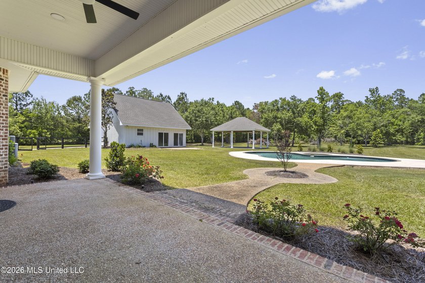 Tucked behind a gated entrance on 5 private acres, this - photo 59
