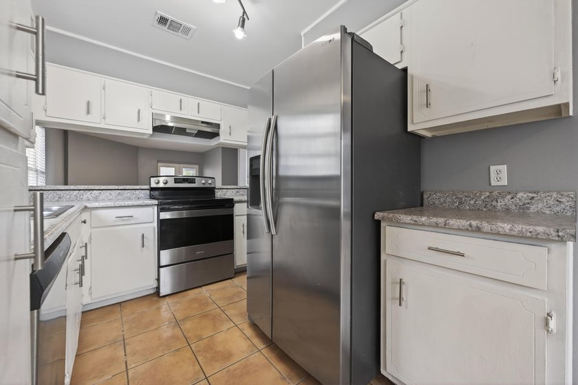 Welcome to this 2-bedroom, 2-bathroom first-floor corner unit in - photo 6