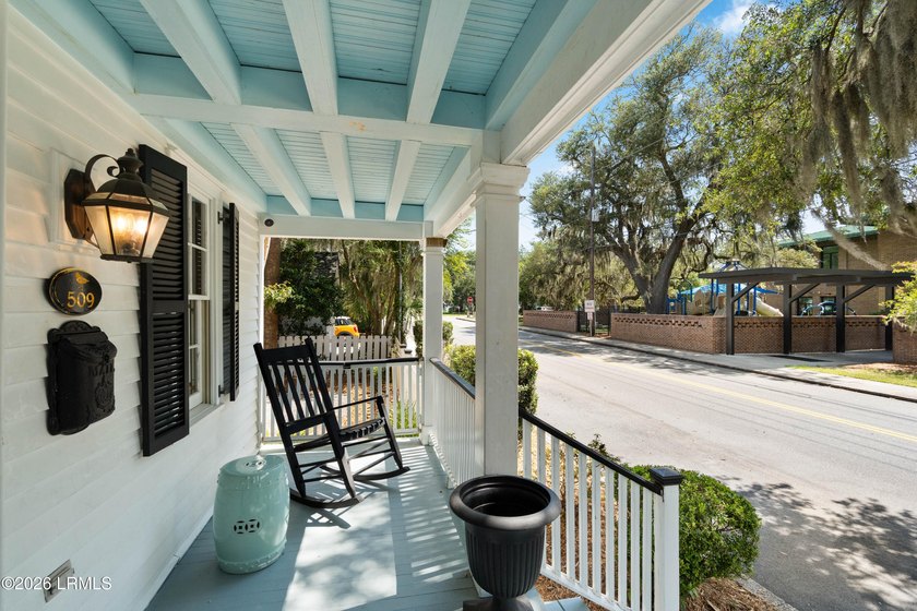 Anchored by a magnificent 400 year old live oak at the front of - photo 3