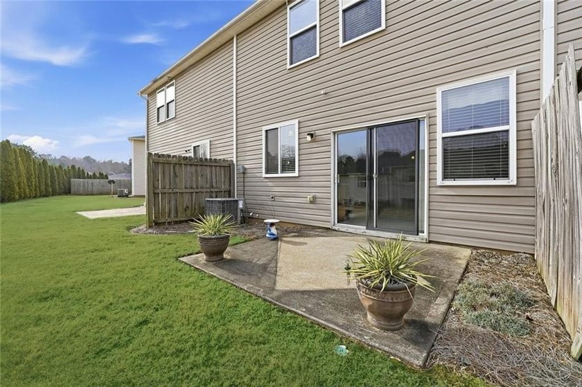Built in 2005, this 1,551 sq. ft. 2-story townhome features 3 - photo 3