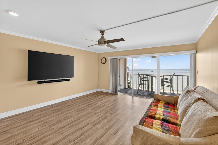Rare opportunity to own a 3rd-floor end unit in the gated - photo 6