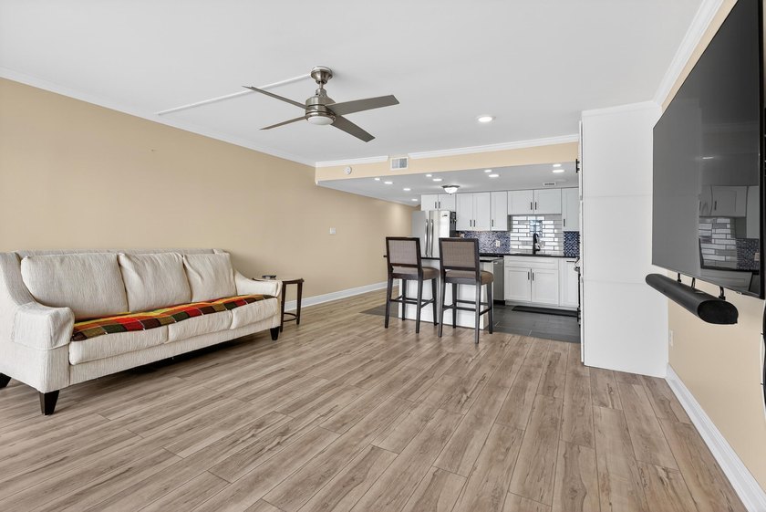 Rare opportunity to own a 3rd-floor end unit in the gated - photo 9