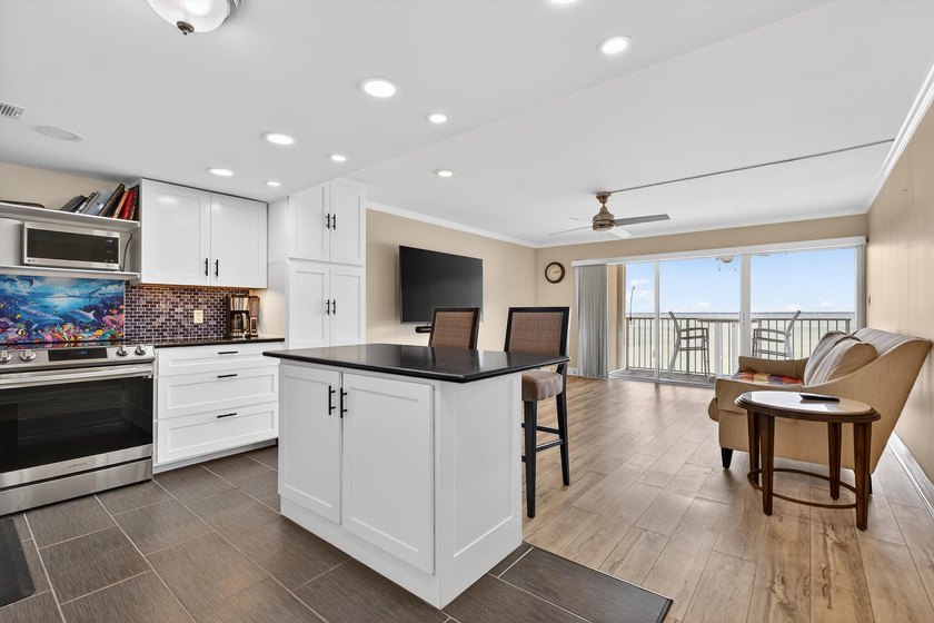 Rare opportunity to own a 3rd-floor end unit in the gated - photo 10
