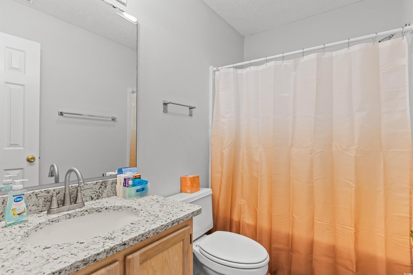 This move-in ready third-floor condo in the River Oaks community - photo 20