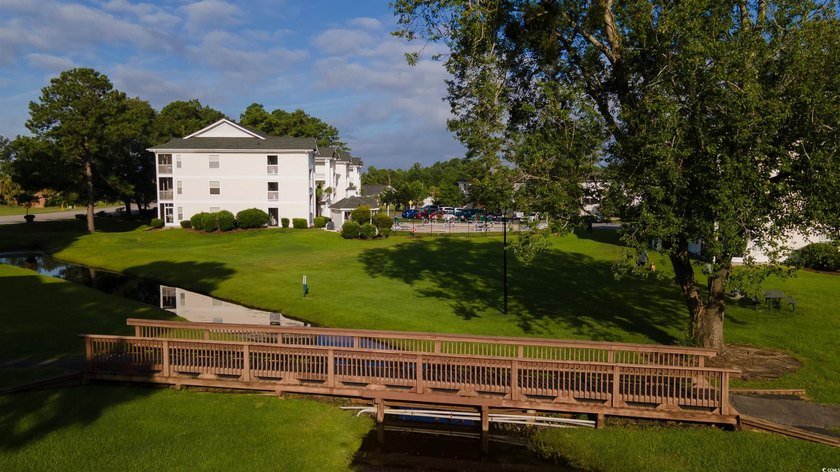 This move-in ready third-floor condo in the River Oaks community - photo 30