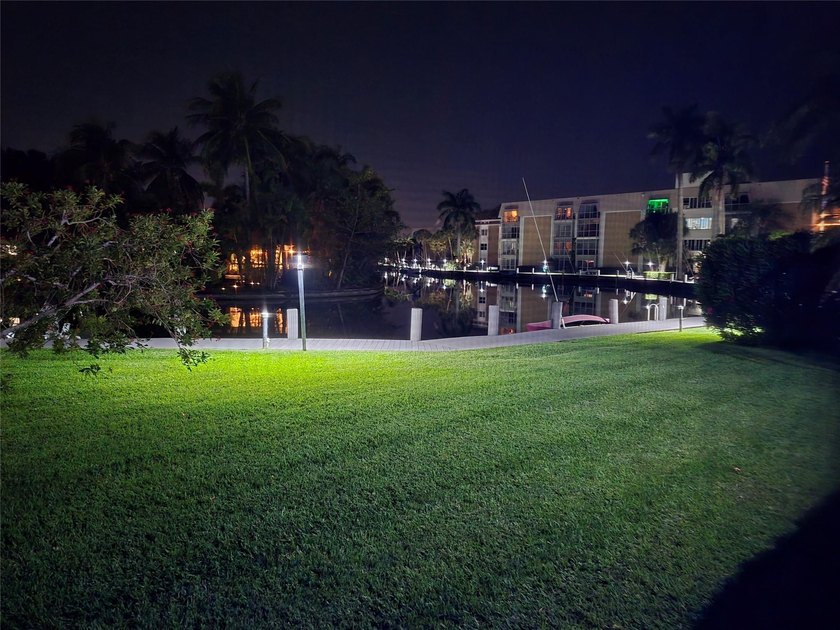 Tranquil water and lawn view on the river. Lovely boardwalk for - photo 2