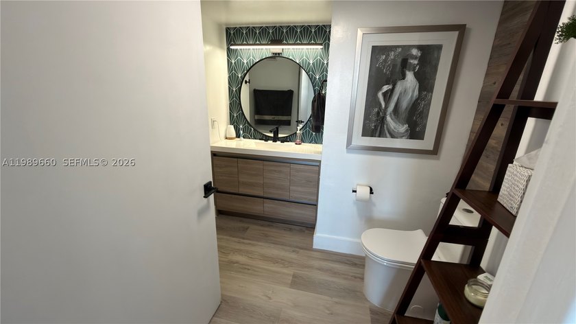 Beautifully updated and move-in ready 2/2 unit in the highly - photo 18