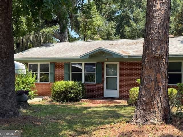 Welcome to this quaint, all-brick home nestled in the heart of - photo 3