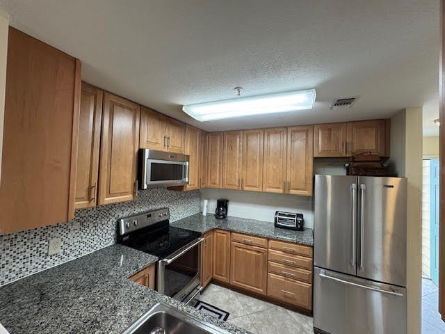 This fully furnished ground floor condo has tile floor and - photo 6