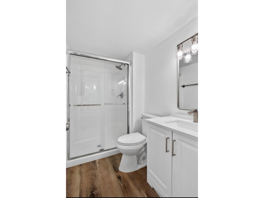 THIS ONE IS A MUST SEE ! BEAUTIFULLY RENOVATED FIRST FLOOR UNIT - photo 13