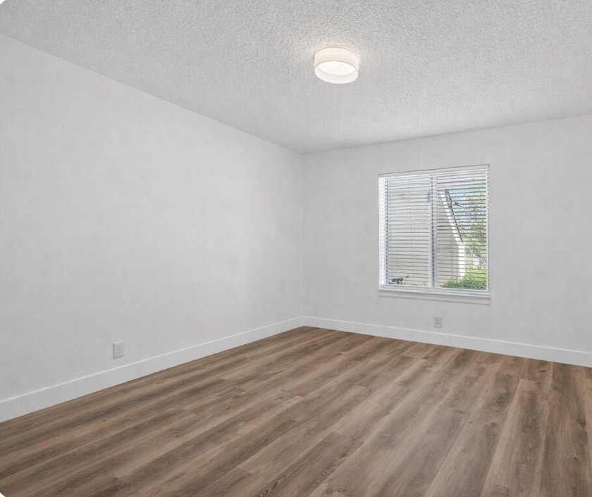 THIS ONE IS A MUST SEE ! BEAUTIFULLY RENOVATED FIRST FLOOR UNIT - photo 14