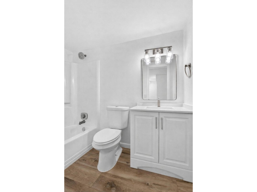THIS ONE IS A MUST SEE ! BEAUTIFULLY RENOVATED FIRST FLOOR UNIT - photo 16