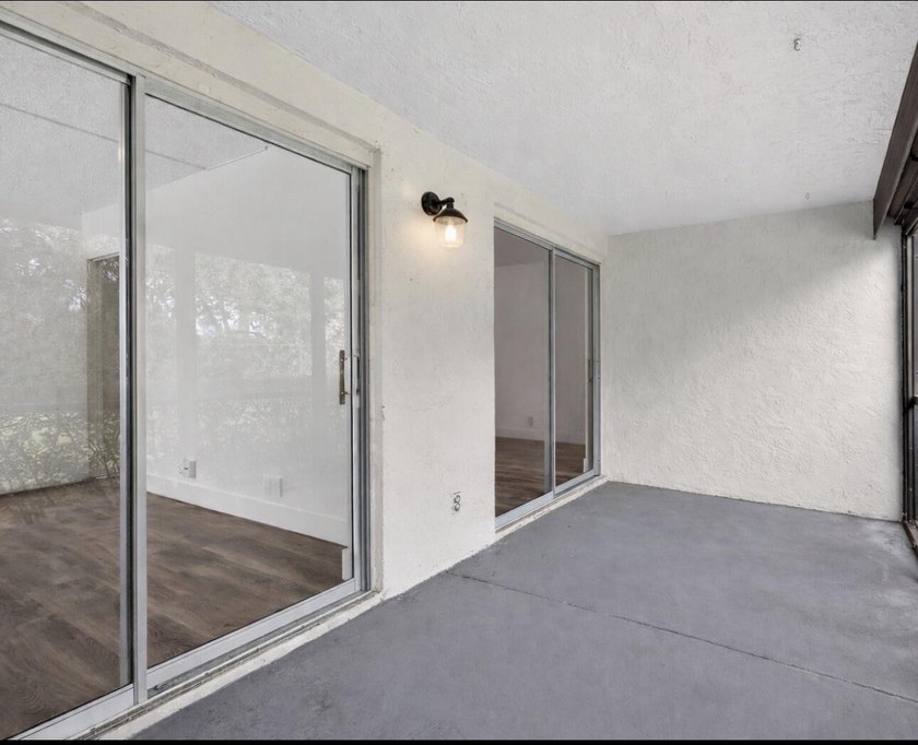 THIS ONE IS A MUST SEE ! BEAUTIFULLY RENOVATED FIRST FLOOR UNIT - photo 19