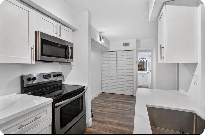 THIS ONE IS A MUST SEE ! BEAUTIFULLY RENOVATED FIRST FLOOR UNIT - photo 28